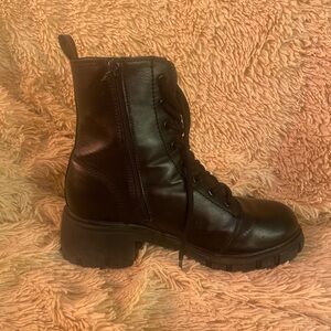 Black “Mia” heeled zip up combat boots
